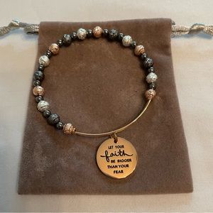 Gold beaded bracelet with charm